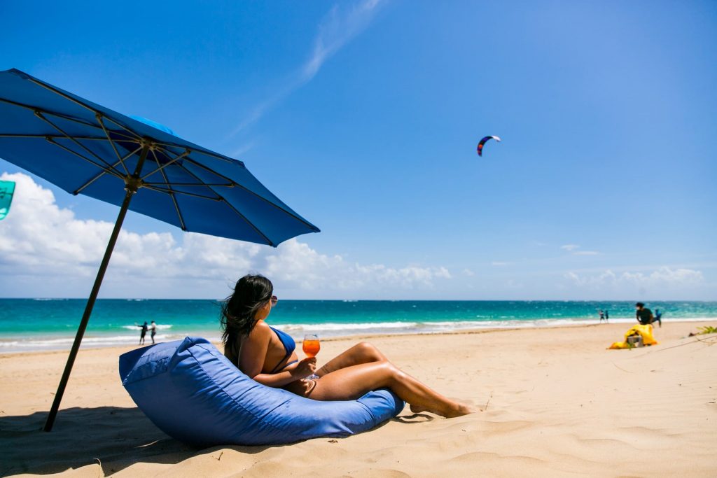 Woman with a drink on Ocean Park beach